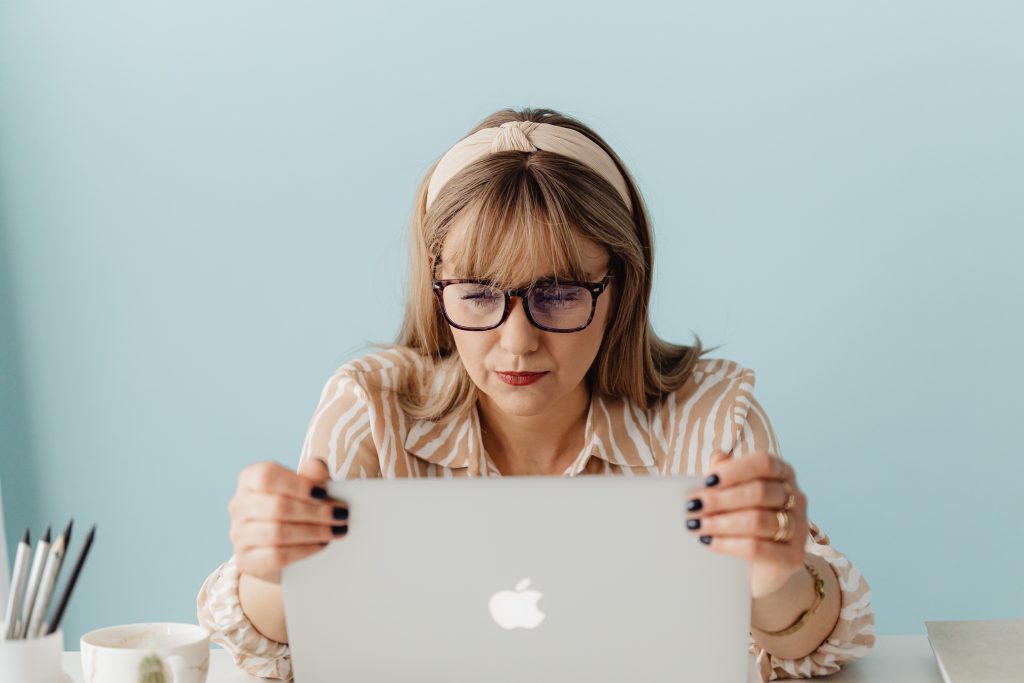 A business owner using an SME website builder to create a professional website easily.
